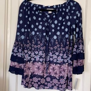 Floral top with lace detailing.